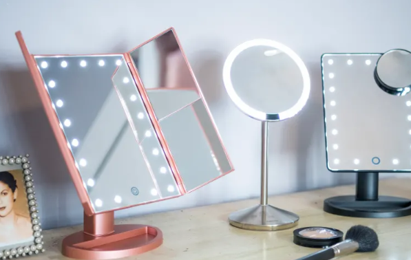 What are the benefits of using a lighted makeup mirror